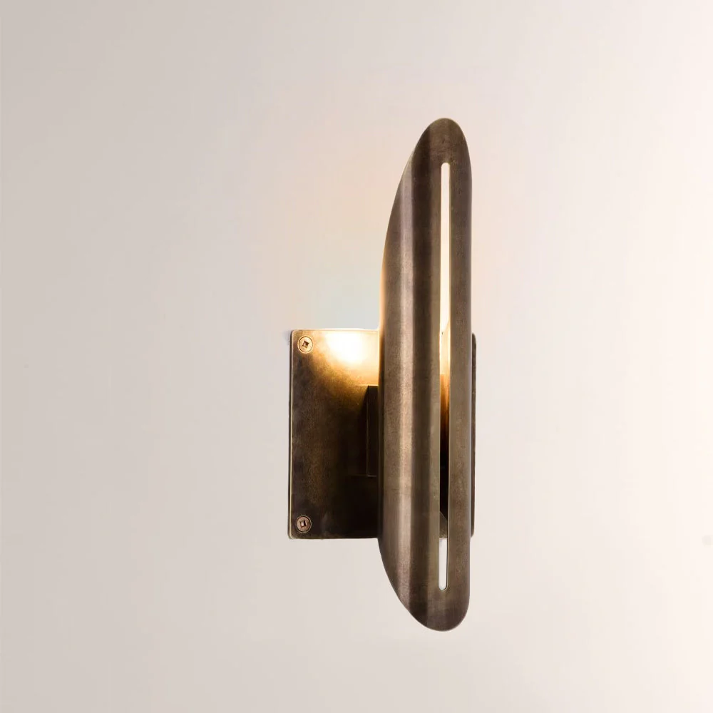 Voyant Curved Sculptural Brass Wall Sconce - Image 1